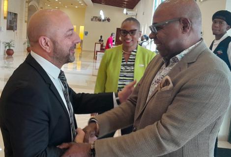 (HM Digicel) Minister of Tourism, Hon. Edmund Bartlett (right) gets a warm greeting from Chief Executive Officer of Digicel Jamaica, Stephen Murad on his arrival at the Montego Bay Convention Centre on Friday, July 18, 2025 to address the Digicel Business Hospitality Event. At centre is Digicel’s Director of Government and Corporate Relations, and Chairman of the Digicel Foundation, Joy Clarke.