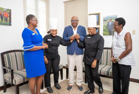 Minister of Tourism, Hon Edmund Bartlett (centre) congratulates Mernel Casey (2nd right) who has been promoted to the top position of Executive Sous Chef at Hyatt resorts in Montego Bay, having received certification through JCTI. Co-worker, Shamanda Barnes (2nd left) was also commended on being promoted to Chef de Cuisine, having also been certified. Accompanying them on a courtesy call on Minister Bartlett is Hyatt’s Human Resources Manager, Betty Ann Brown (left) & Director of the JCTI, Carol Rose Brown.
