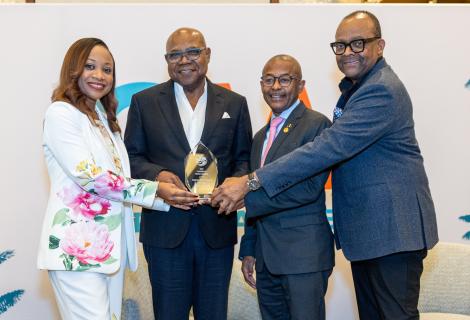: Minister of Tourism, Hon Edmund Bartlett (2nd L) accepts the Caribbean Media Award for Best Social Media Campaign at CTO Week in New York on June 2. Sharing in the moment are (L-R) Donna Regis-Prosper, Secretary Geneal of the Caribbean Tourism Organization (CTO), Minister of Tourism for Barbados and Chairman of CTO, Hon Ian Edgehill-Gooding and Director of Tourism, Donovan White.