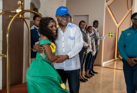 Minister of Tourism, Hon Edmund Bartlett (right) receives a welcome hug, one of the many he received on his tour of Royalton Negril on Tuesday, August 25, 2026. Management and staff were out in their numbers to greet the Minister at the restart of operations following a multi-million-dollar restoration in the wake of last year’s hurricane.