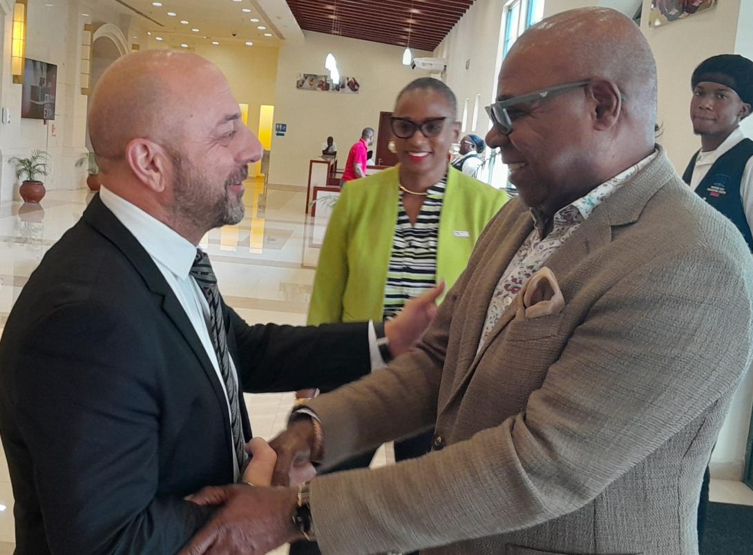 (HM Digicel) Minister of Tourism, Hon. Edmund Bartlett (right) gets a warm greeting from Chief Executive Officer of Digicel Jamaica, Stephen Murad on his arrival at the Montego Bay Convention Centre on Friday, July 18, 2025 to address the Digicel Business Hospitality Event. At centre is Digicel’s Director of Government and Corporate Relations, and Chairman of the Digicel Foundation, Joy Clarke.