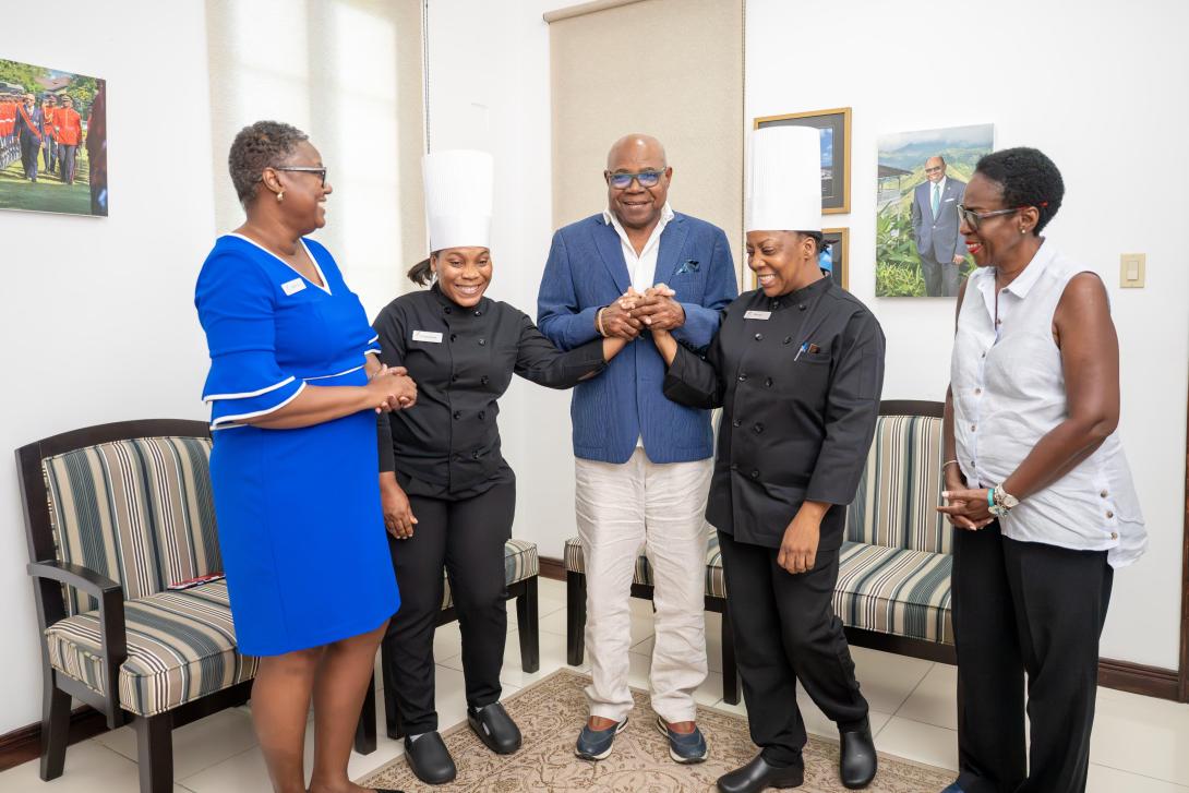 Minister of Tourism, Hon Edmund Bartlett (centre) congratulates Mernel Casey (2nd right) who has been promoted to the top position of Executive Sous Chef at Hyatt resorts in Montego Bay, having received certification through JCTI. Co-worker, Shamanda Barnes (2nd left) was also commended on being promoted to Chef de Cuisine, having also been certified. Accompanying them on a courtesy call on Minister Bartlett is Hyatt’s Human Resources Manager, Betty Ann Brown (left) & Director of the JCTI, Carol Rose Brown.