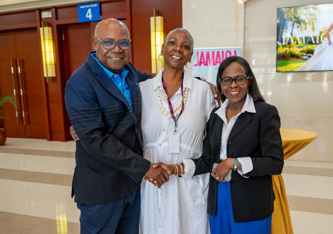 Minister Bartlett (left) shares a quick photo with two participants in the Jamaica Bridal Expo 2025 held at the Montego Bay Convention Centre (MBCC) on Saturday, September 27, 2025. 