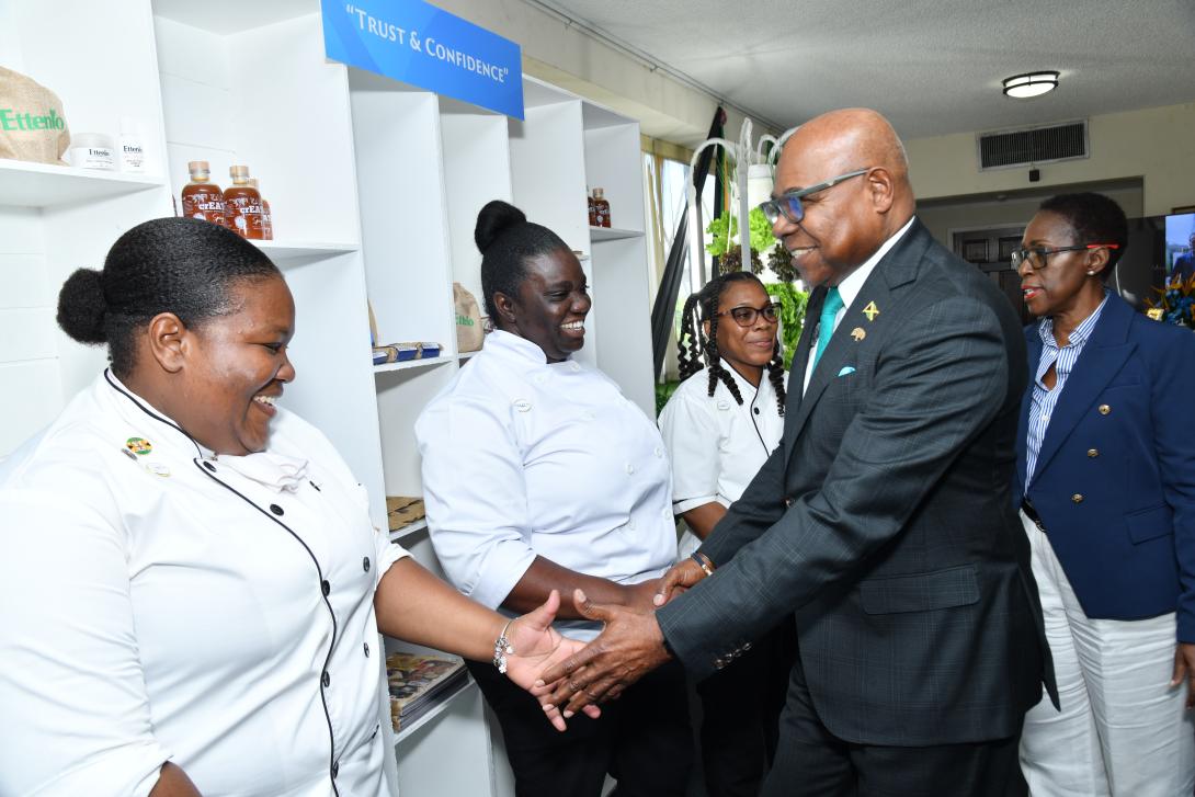 Minister of Tourism, Hon. Edmund Bartlett (2nd right) is joined by Director of the Jamaica Centre for Tourism Innovation (JCTI), Carol Rose-Brown (right) in greeting a portion of the first cohort of executive sous chefs trained and graduated by any Caribbean country outside the chamber of Gordon House ahead of his 2026 Sectoral Debate Presentation on Tuesday, June 23, 2026. 