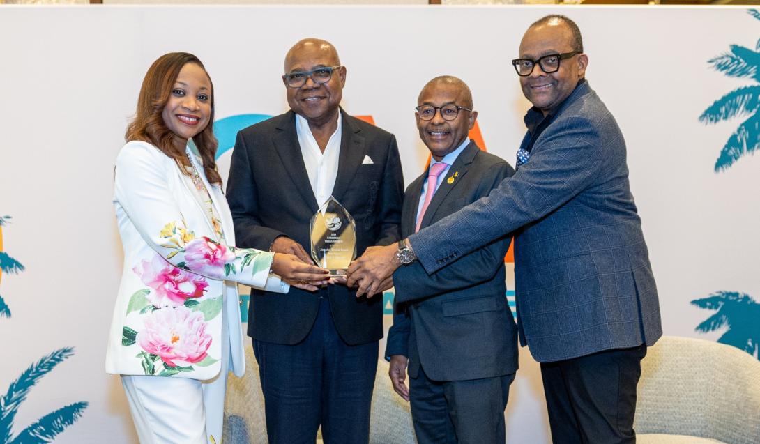: Minister of Tourism, Hon Edmund Bartlett (2nd L) accepts the Caribbean Media Award for Best Social Media Campaign at CTO Week in New York on June 2. Sharing in the moment are (L-R) Donna Regis-Prosper, Secretary Geneal of the Caribbean Tourism Organization (CTO), Minister of Tourism for Barbados and Chairman of CTO, Hon Ian Edgehill-Gooding and Director of Tourism, Donovan White.