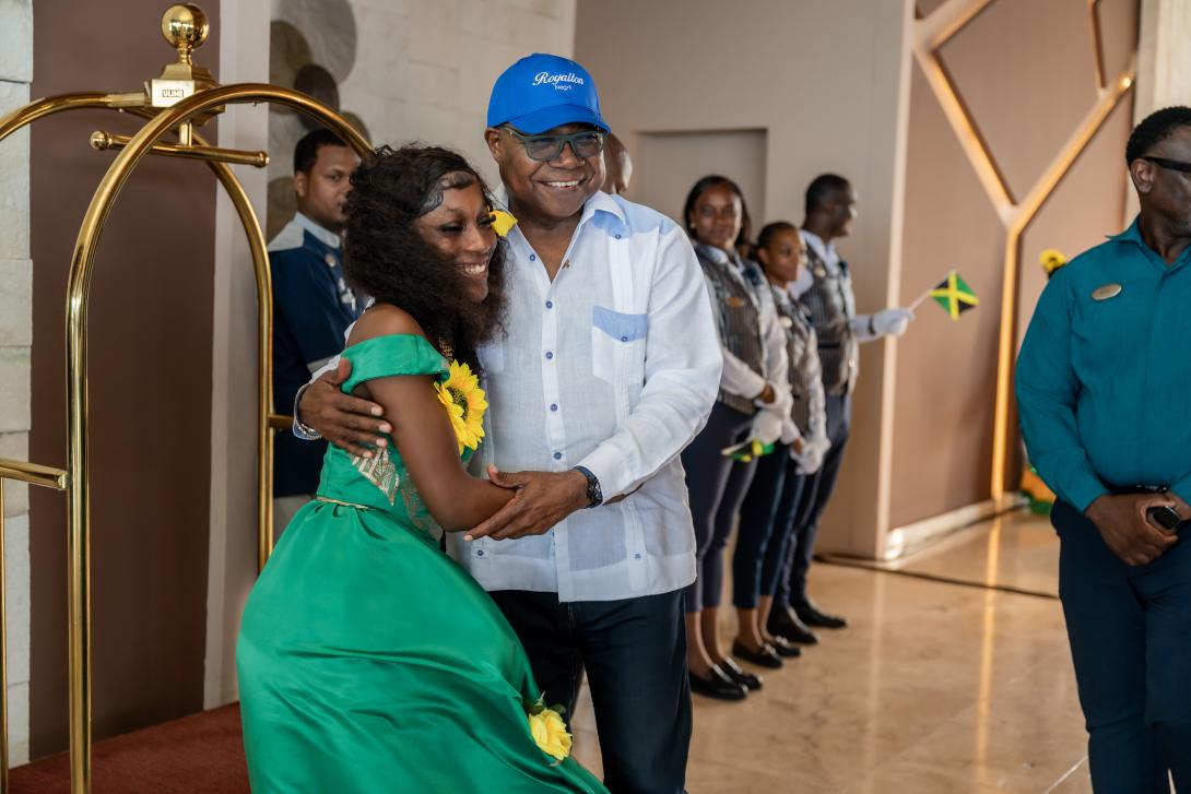 Minister of Tourism, Hon Edmund Bartlett (right) receives a welcome hug, one of the many he received on his tour of Royalton Negril on Tuesday, August 25, 2026. Management and staff were out in their numbers to greet the Minister at the restart of operations following a multi-million-dollar restoration in the wake of last year’s hurricane.